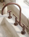 Aged Copper Bridge Kitchen Faucet with Side Sprayer
