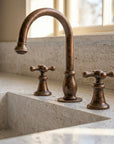 Aged Copper Widespread Bathroom Faucet with Cross Handles