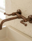 Rustic Aged Copper Wall Faucet with Crossbar Lever Handles