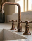 Aged Copper Widespread Bathroom Faucet with Cross Handles