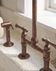 Aged Copper Bridge Kitchen Faucet with Side Sprayer